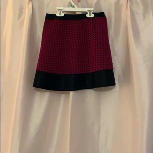 Candie’s dark magenta and faux leather skirt